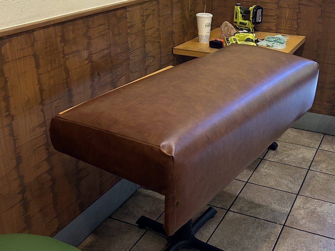Reupholstered saddle-brown vinyl corner booth bench installed on site at a San Diego Rubio's Coastal Grill